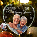 Art Design,Christmas,Humorous,Gift For Couples,Photo - Caricature - Remove BG - Custom Photo Caricature Annoying Each Other And Still Going Strong - Personalized Heart Shaped Glass Ornament