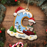 Christmas, Family, Playful, Vector - Gift For Family Kids - Personalized Name And Character Sitting On Snowy Christmas Initial Wooden Ornament